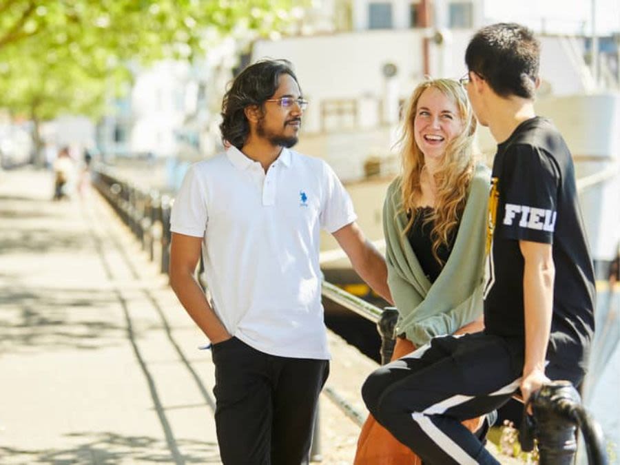 University of Bristol students by Bristol Harbourside