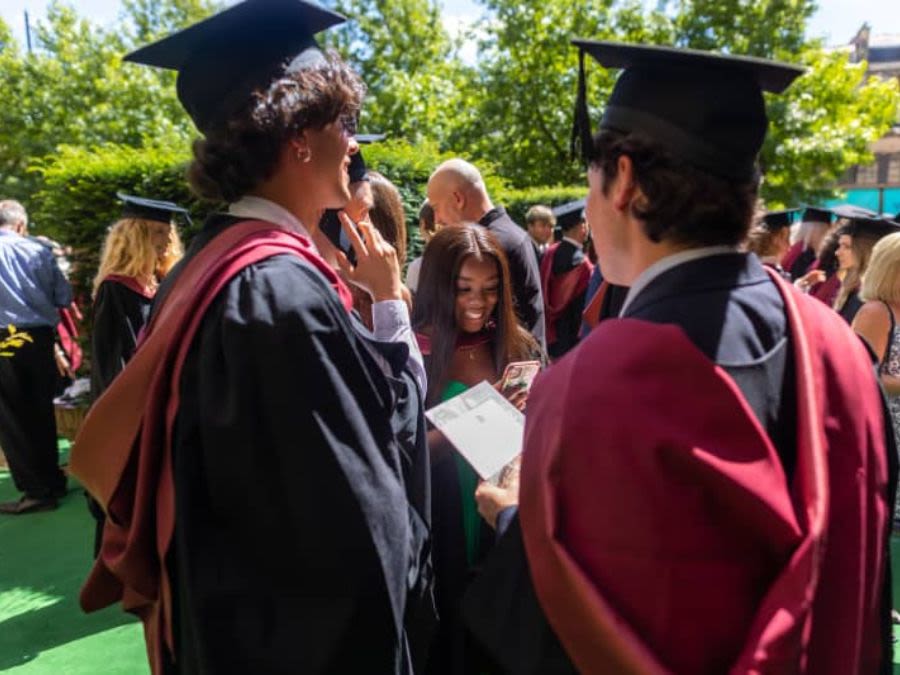 Graduates in Centenary Gardens after their ceremony