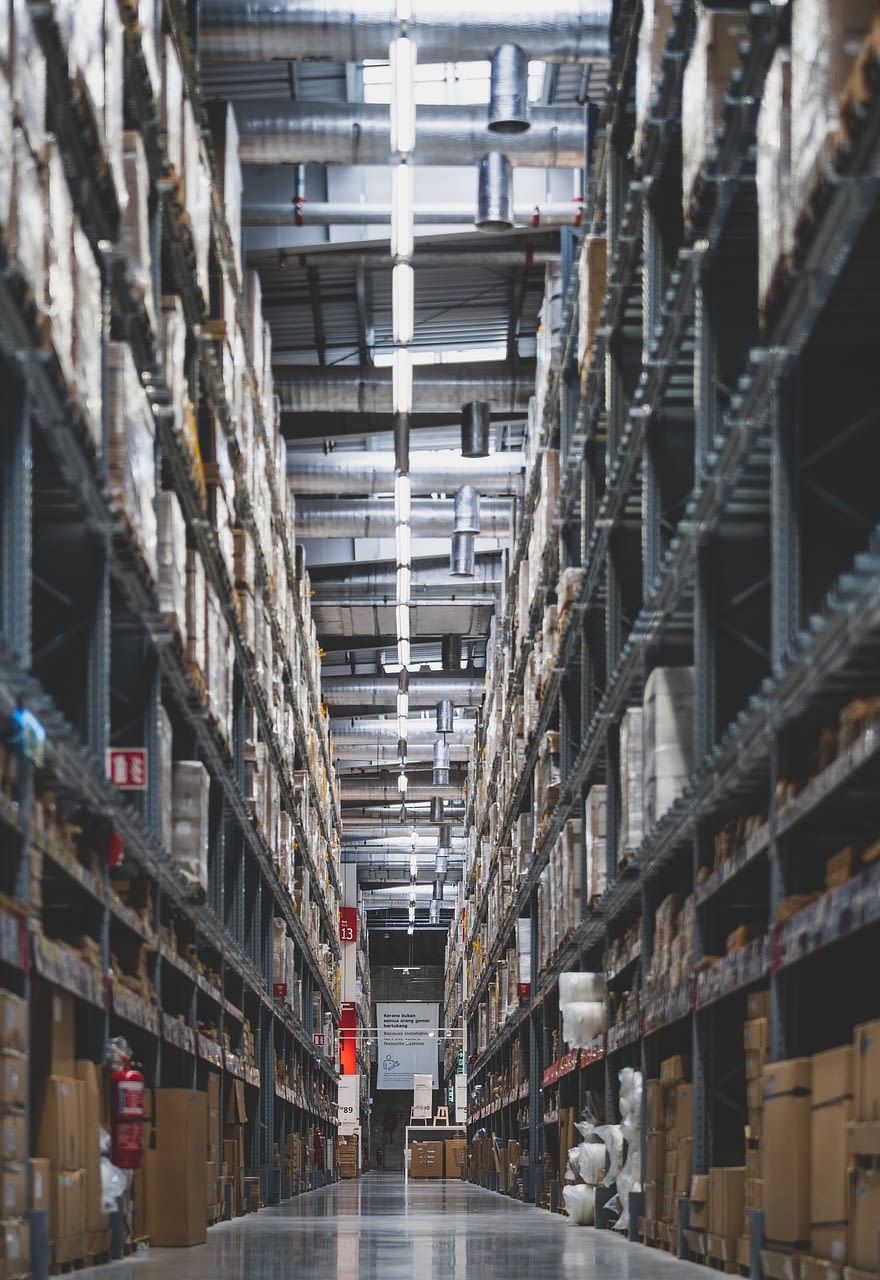 A warehouse full of electrical equipment stacked on high shelves
