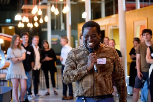 A man with microphone at event