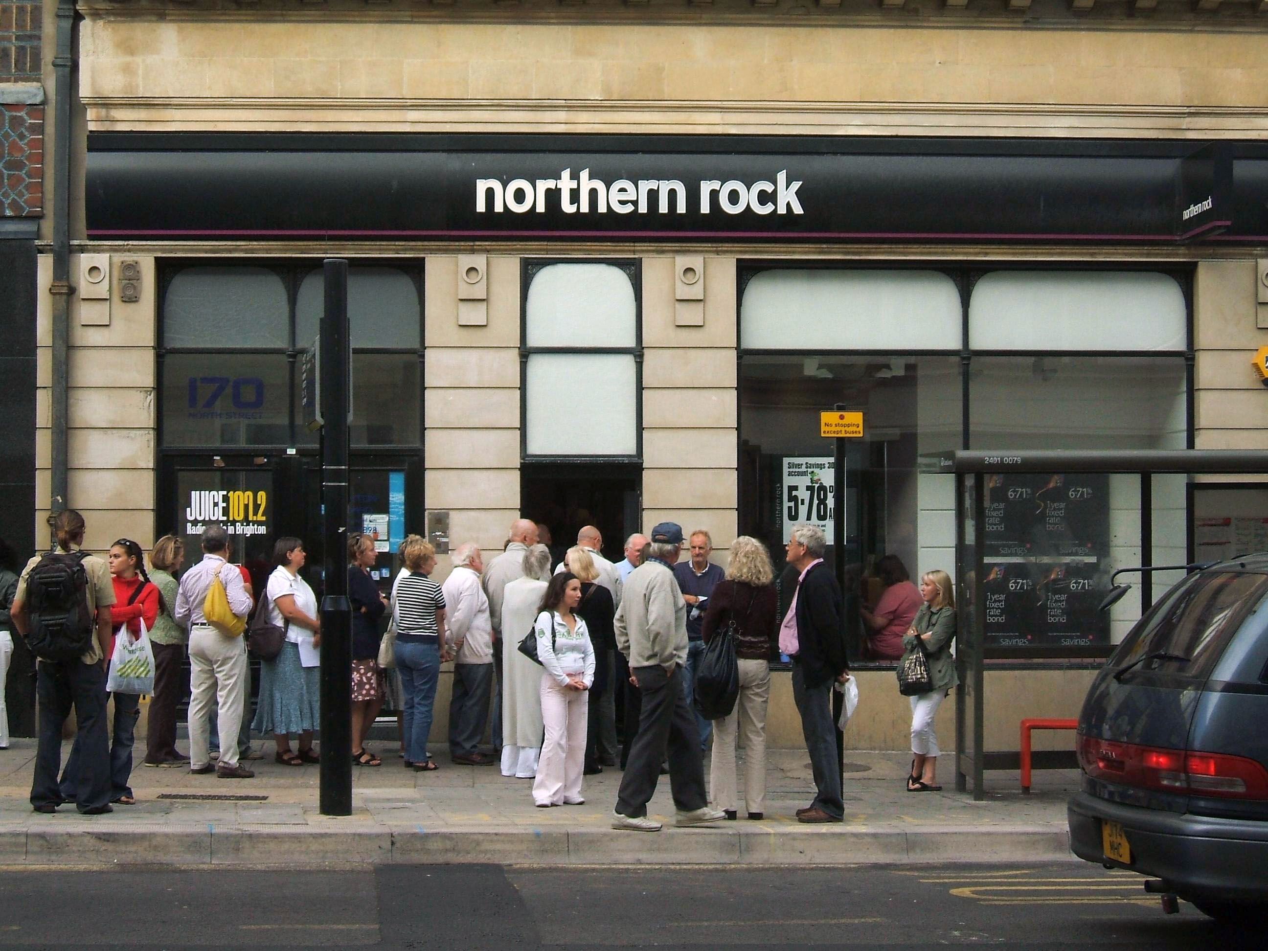 A crowd of people waiting to withdraw money outside a branch of Northern Rock, as the bank collapses
